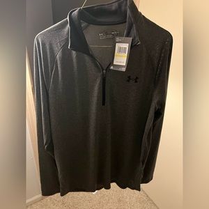 Never been worn! Under Armour 1/2 zip up long sleeve collared workout shirt.